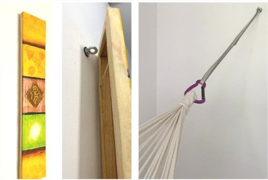Piton pour hamac caché derrière un tableau