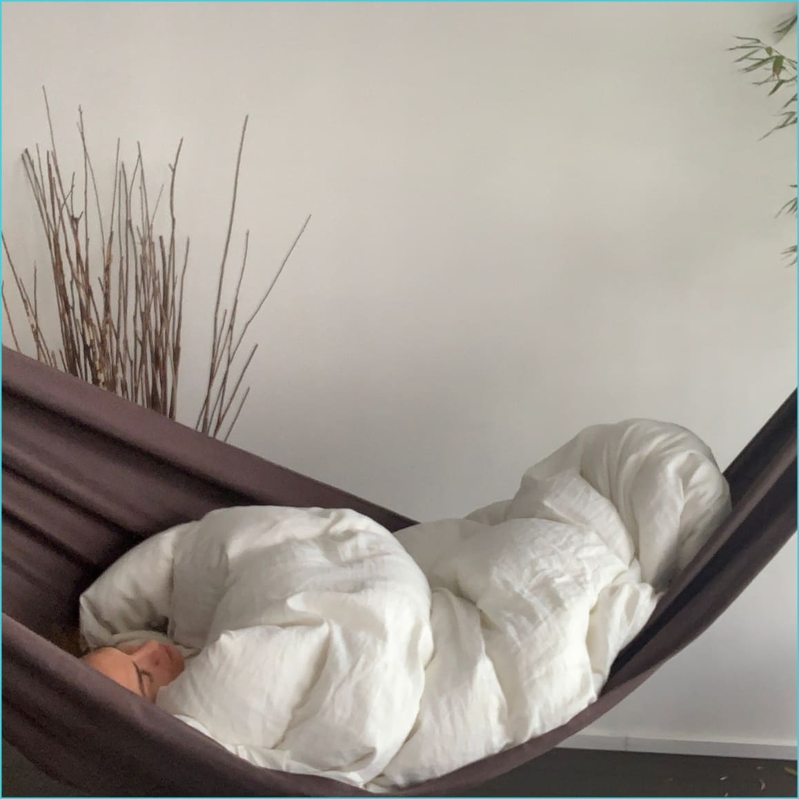 Dormir dans un hamac avec une couette